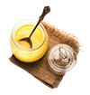 ghee-clarified-butter-close-up-wooden-bowl-silver-spoon-selective-focus_466689-23146